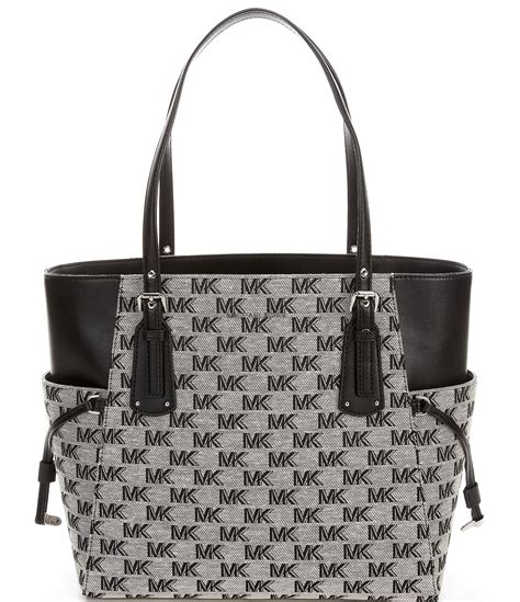 michael kors mk logo east west pvc tote|Michael Kors voyager signature tote.